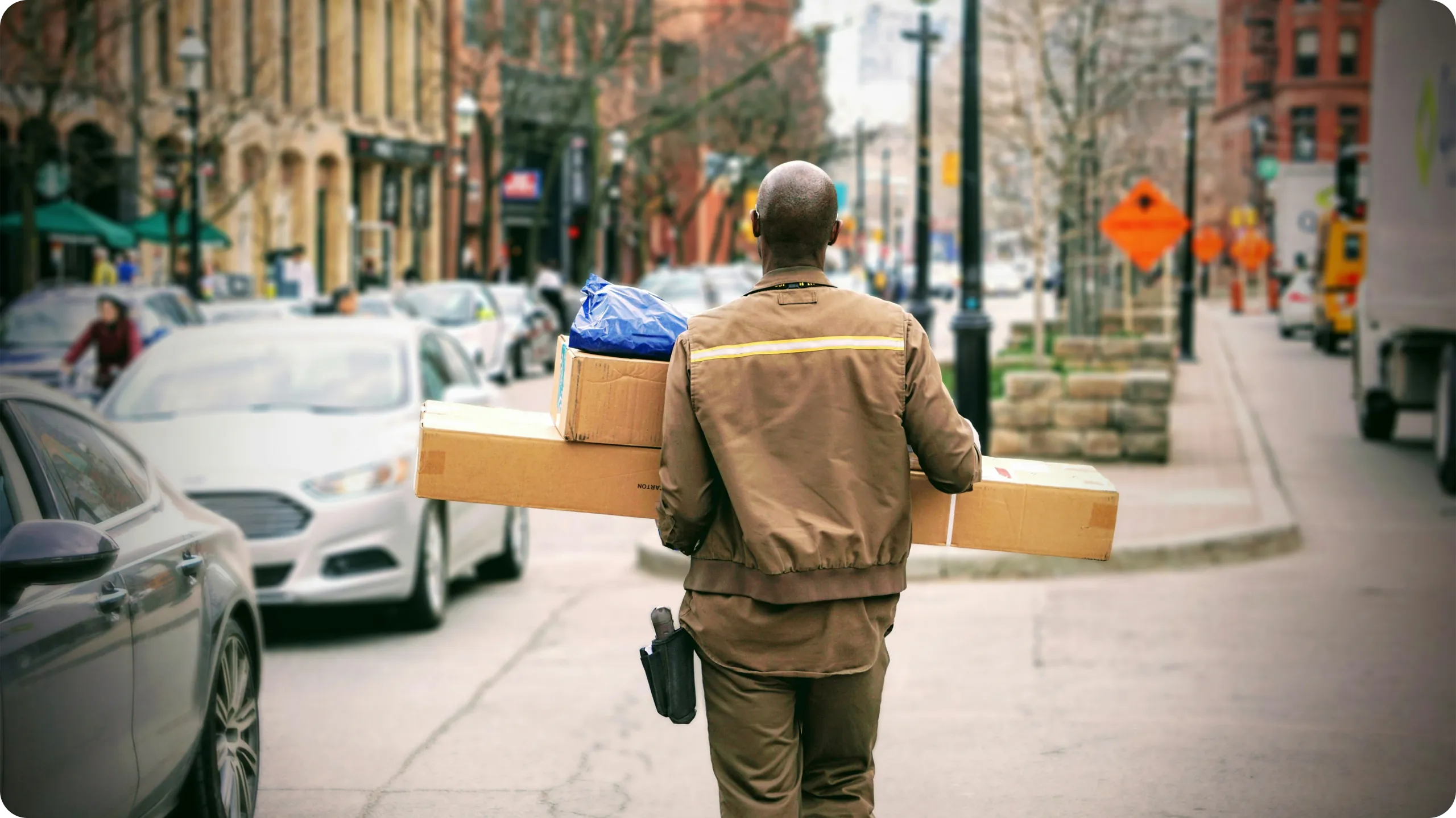 Mail carrier delivering packages.