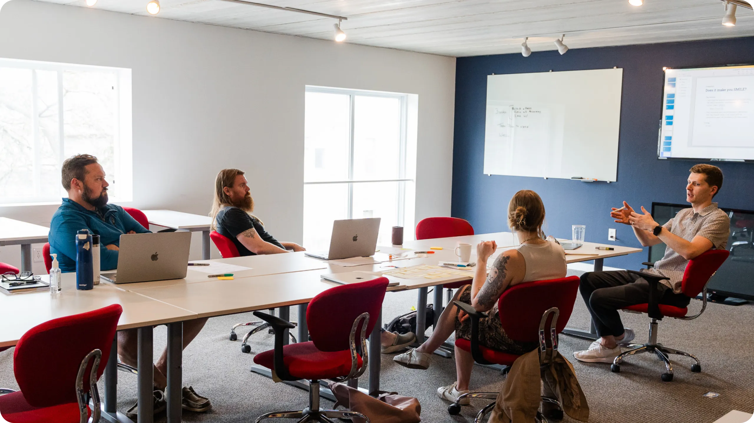 Livefront staff members collaborating in a meeting.