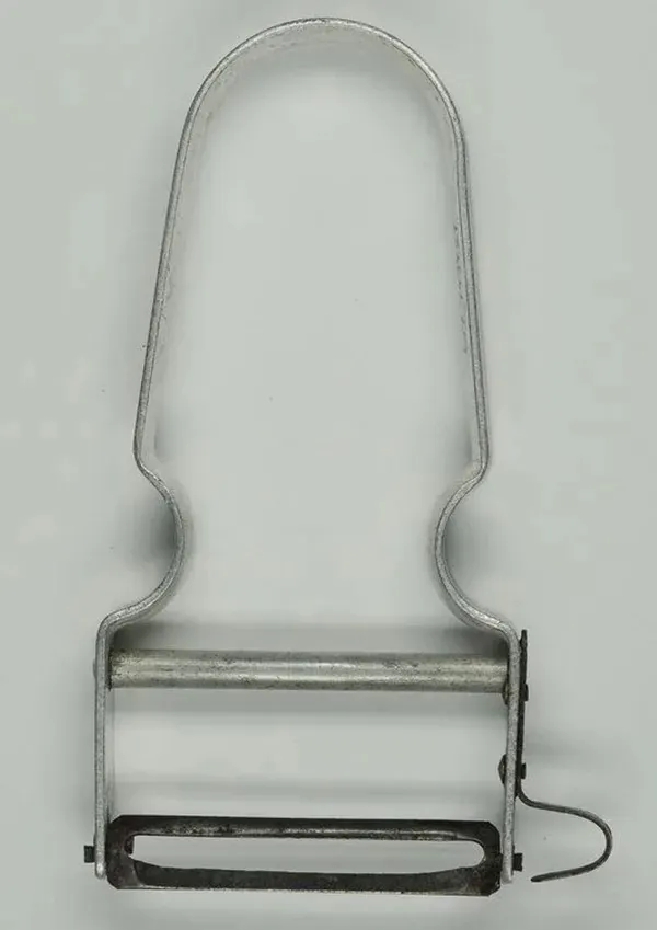 A top-down view of the Rex peeler. It is steel, with a carbon blade, against a white background.